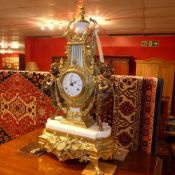 An Italian  Imperial gilt metal mantel clock with enamelled dial and having cherub figural mounts on