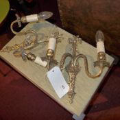 A pair of gilt metal twin branch wall sconces