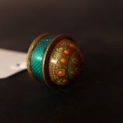 A miniature ball tape measure decorated with flowers