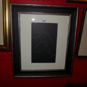 An Eric Gill print after woodcut of a female nude glazed and framed