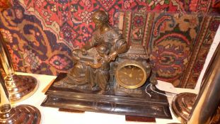 A mid C19th French bronze and black slate mantel clock, with allegorical figures representing
