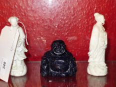 A pair of Blanc de Chine figurines and a glitter stone Buddha