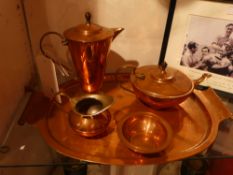 An Arts and Crafts Benson Cooper four piece tea and coffee set on matching tray stamped to the base