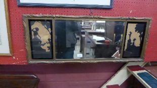 A small wall mirror the bevelled plate flanked by silhouettes in gilded frame 91 x 35.5cm