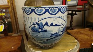 A Chinese style blue and white planter of bulbous form