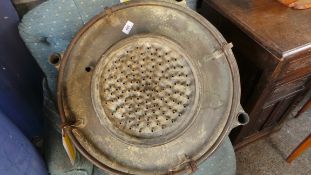 A vintage copper industrial shower head