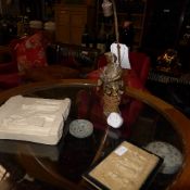 A gilt metal figure table lamp on griott