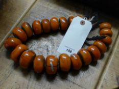 A large faux amber bead necklace