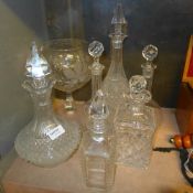A collection of decanters and stoppers a