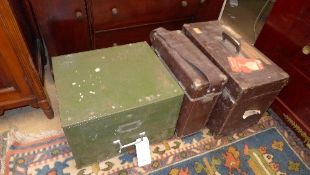 A bygone metal filing drawer and a leather clad travelling case