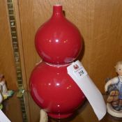 A ceramic glazed gourd vase