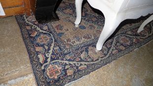 A hand knotted Persian rug the navy blue