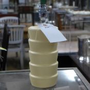A pair of contemporary conical tiered ta