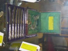 A cased set of silver handle butter kniv