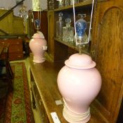 A pair of pink porcelain bulbous table l