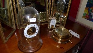 A Miller ship clock, a cased skeleton cl