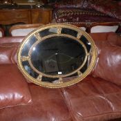 A Georgian style giltwood oval wall mirror