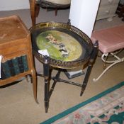 A Regency design toleware tray depicting spaniels raised on simulated bamboo base