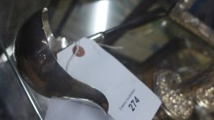 A silver punch ladle