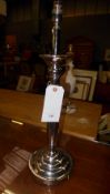 A pair of silver plated table lamps on circular base