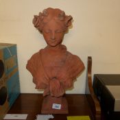 A Victorian style terracotta composition bust of a maiden