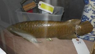 A brass carp of naturalistic form