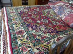A fine North-West Persian Tabriz rug 195 cm x 140 cm central book cover design with repeating