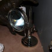 A pair of chromium magnifying glass on s