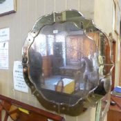 An Art Deco coloured glass wall mirror w