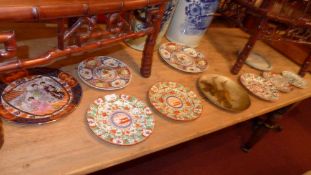 A collection of plates, including three hand painted polychrome examples, a Wedgwood Jasperware dish