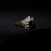 A ladies 9ct gold sapphire and diamond chip ring