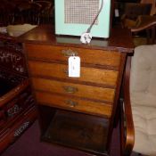 A C19th oak chest of narrow proportions fitted four drawers above open recess