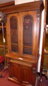 A Victorian mahogany library bookcase fitted pair of glazed panel doors above frieze drawer and