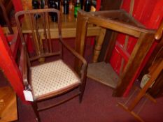A pair of Edwardian mahogany elbow chairs with upholstered pad seats on stretchered supports