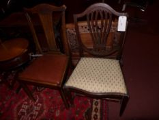 A group of four C19th chairs including a Hepplewhite style and a ladder back with rush seat