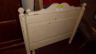 An antique painted pine single bedstead with side rails