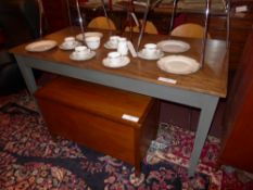 A pine farmhouse table the rectangular top raised on grey painted tapering supports