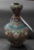A pair of Chinese cloisonne vases of baluster form decorated with polychrome flowers