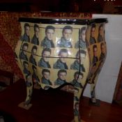 A French bombe form chest fitted with two drawers and decorated with images of Elvis Presley