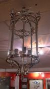 A chrome and glazed cylindrical form hanging lantern SOLD IN TIMED SALE