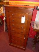 A Victorian mahogany Wellington chest fitted seven drawers with locking stile raised on plinth base