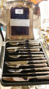 A sterling silver dressing mirror and silver handled pastry forks and knives