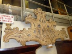 A large profusely carved wall applique