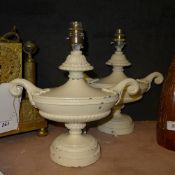 A pair of white painted metal Neo-Classical design urns converted into table lamps