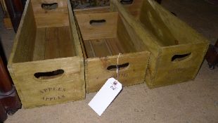 A set of three wooden storage boxes