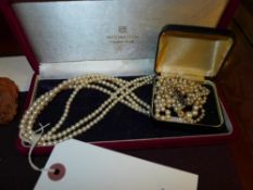 A Mikimoto cultured pearl necklace and a