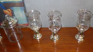 A set of glass and chrome storm lights