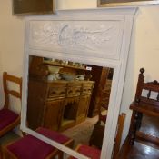 A distressed painted wall hanging mirror
