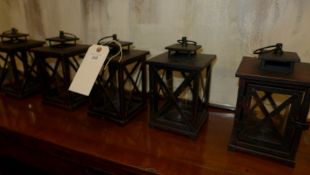 A set of five small storm lanterns