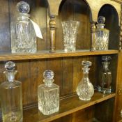 A collection of cut glass decanters